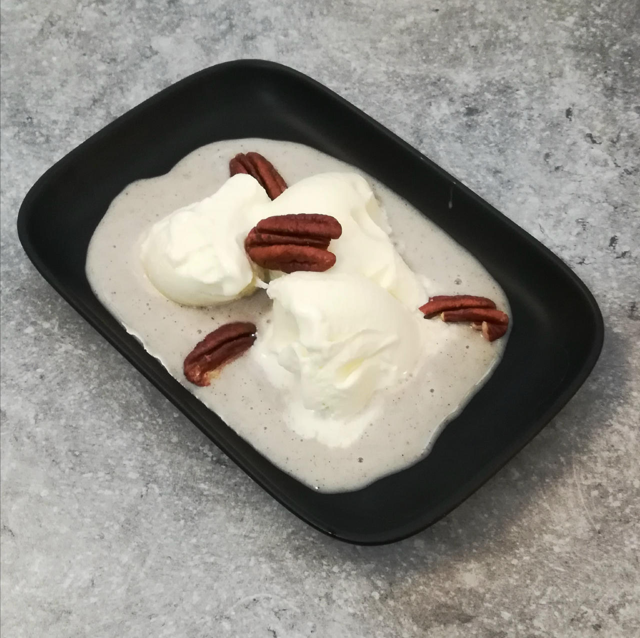 Served on a vanilla sauce bed, with pecans